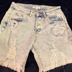 I am selling ripped blue jean shorts that was barely worn (has no tags sorry)